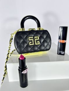 Beautiful Quilted PU Leather Lipstick Case Necklace/ Purse. Comes leather and gold chain. Great when your on the go for your Airpods, jewelry, or small lip gloss, keys, spare change/money holder etc. Purse comes Black PU leather with gold hardware. Removable chain.  Inside is mirrored on both sides for when you need a mirror to apply or check your lipstick! Measurements: 4 inches W, 3 inches H and 1.3 inches D.  Please reach out with any questions! See more items in this category: https://www.et Airpods Jewelry, Small Lips, Money Holder, Spare Change, Lipstick Case, Mini Purse, Purse Charms, Gold Hardware, Gold Chains