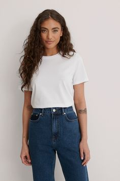 This t-shirt features a rounded neckline. It has short sleeves and a relaxed fit. Logo Design Inspiration Branding, Clothing Mockup, Todays Outfit, Na Kd, Capsule Wardrobe, Cotton T Shirt, Cotton Tshirt, Round Neck, Summer Outfits