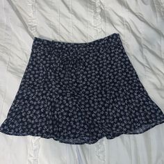 Fun And Flirty Floral Mini Skirt! Adorable Ruffled Bottom And Tie Belt Around The Waist. Zips On The Side. Brand New With Tags. Size S. The Material Does Not Have Much Stretch In The Waistband. White Skirt With Blue Flowers, Casual Blue Floral Print Mini Skirt, Blue Floral Print Mini Skirt, Blue Floral Print Tiered Mini Skirt, White Plaid Skirt, Mini Leather Skirt, Retro Blue Floral Print Skirt, Camo Mini Skirt, White Floral Skirt