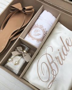 an open box containing personal items for brides and groomsmid's gifts