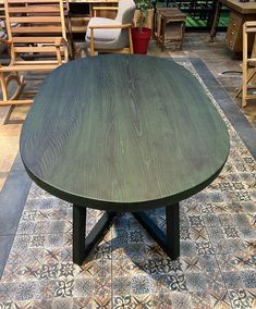 a wooden table sitting on top of a tiled floor