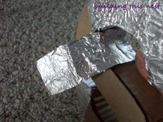 a piece of tin foil sitting on top of a cardboard box