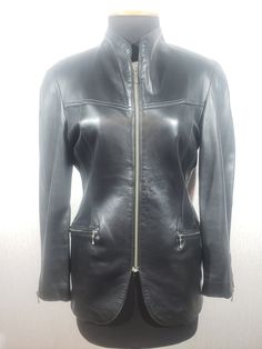 Stylish women's black leather jacket made of genuine leather. Reliable women's black jacket with a zipper. The jacket is made of strong, soft black genuine leather. The jacket is easily fastened with a metal zipper. The jacket has reliable pockets with metal zippers at the bottom and one in the middle. Jacket cuffs with metal zippers. The jacket has a nice polyester lining with artificial insulation. The design of the jacket combines a sporty and classic style, which allows you to use the jacket Sleek Formal Leather Jacket With Zipper Closure, Formal Black Leather Jacket, Leather Biker Jacket For Business, Elegant Black Leather Jacket With Zipper Closure, Elegant Fitted Biker Jacket With Zip Fly, Elegant Black Outerwear With Zipper Closure, Elegant Leather Jacket With Zip Fly, Fitted Leather Jacket With Zipper Closure For Business, Elegant Black Biker Jacket With Zipper Closure