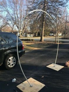 a car is parked on the side of the road with a hose attached to it