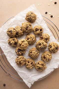 a bunch of oatmeal cookies sitting on top of a white paper towel