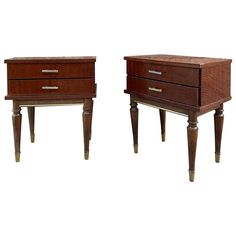 two wooden nightstands sitting next to each other on top of a white background,