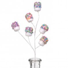 a vase filled with marshmallows and sprinkles