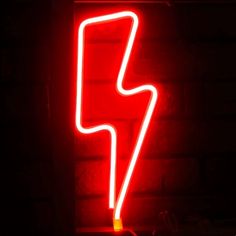 a red neon sign with a lightning bolt on it