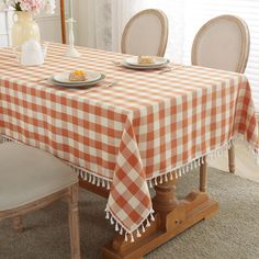 PRICES MAY VARY. Classic Gingham Tablecloth: Features the classic buffalo checkered pattern in orange and white to create the best farmhouse look, edged in jaunty tassels for a refined finish and playful touch to your decor! Rustic in appearance that suits farmhouse, rustic, or modern decor styles, and will instantly lift the mood of anyone who comes to eat with you Tassel edge design: The linen tablecloth with delicate checked patterns and beautiful fringe tassel gives you a decent elegant feel Buffalo Plaid Fall Table, Fall Table Cloth, Dining Room Orange, Thanksgiving Table Cover, Thanksgiving Tablecloth, Coffee Table Cover, Gingham Tablecloth, Checkered Tablecloth, Plaid Tablecloth