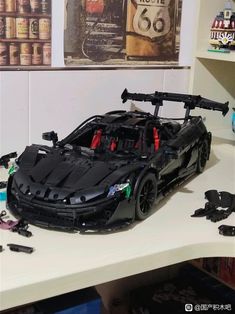 a car made out of legos sitting on top of a table