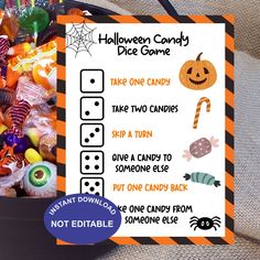 a trick or treat bag with candy in it and a sign that says halloween candy dice game