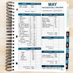 a printable paycheck bill tracker on a wooden table