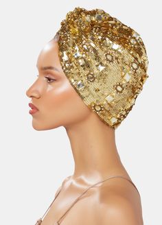 Hand made heavy sequin-embellished turban in gold tones on satin, Incrusted tonal jewels. One Size This is a unique accessory designed by MARYJANE CLAVEROL. Each piece has been carefully hand made with local artisans using the finest materials to become an essential piece in your wardrobe while keeping traditional handcrafting techniques alive. Any variations are due to its small scale manufacturing. Luxury Gold Sequins Embellishments, Tops And Skirts, Turban Headwrap, Embellished Top, Local Artisans, Gold Design, Accessories Unique, Head Wraps, Beanie Hats