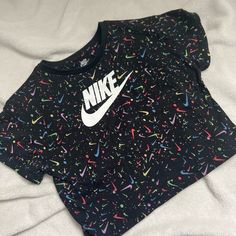 Like New. Girls Crop Top Size 4t. Never Worn. Slight Crop Top. No Stains,Odors Or Rips. Playful Black T-shirt For Spring, Cute Nike Tops For Summer, Cute Nike Summer Tops, Cute Black Shirt For Streetwear, Black Cute Shirt For Streetwear, Cute Black Tops With Graphic Print, Cute Black Short Sleeve Tops, Playful Black Fitted Tops, Playful Fitted Black Tops