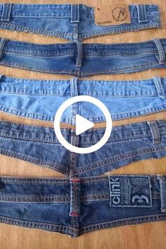 several pairs of blue jeans cut in half on a wooden floor with the words diy written across them