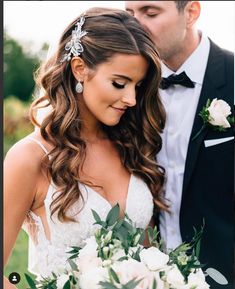 the bride and groom are standing together