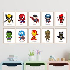 a set of six avengers wall art prints on a white wall above a colorful table