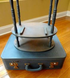 a piece of luggage sitting on top of a hard wood floor