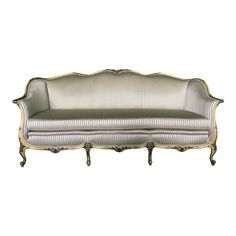 an antique style couch with gold trimming