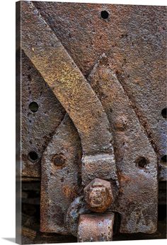 an old rusted metal object with holes in it