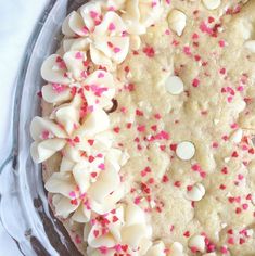 a pie with white and pink sprinkles on it