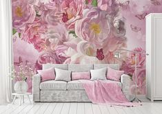 a living room with pink flowers and butterflies on the wall