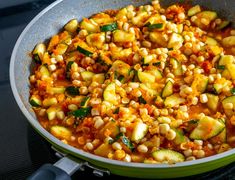 corn and zucchini in a skillet on the stove