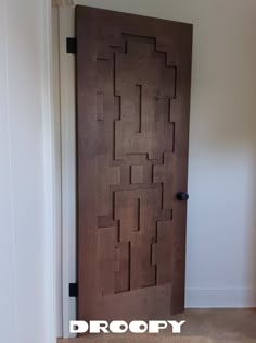 the door is made out of wood and has an interesting pattern on it's side