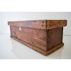 a wooden box sitting on top of a table