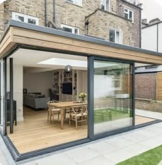 an extension to a house with sliding glass doors