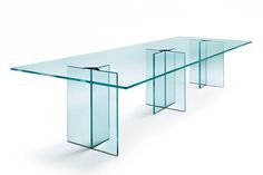 an image of a glass table that is on the white background with no people around it