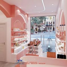 the inside of a store with pink walls and shelves filled with beauty products in front of a large window