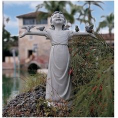 a statue of a woman with birds on her arm and the words shop now above it