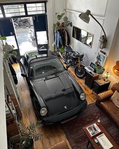 a car is parked in the middle of a living room