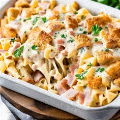 a casserole dish with ham, cheese and parmesan bread on top