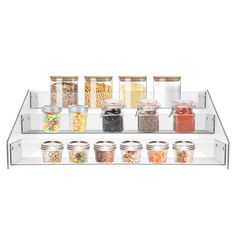 a clear shelf filled with lots of different types of jars and food in containers on top of each other