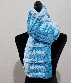 This listing is for a beautiful hand knitted scarf made with loop yarn. The color is Cloudy Sky. It is perfect for any occasion and goes well with any outfit. It is very soft, warm, cozy, and comfortable. It measures approximately 6 inches in with and 62 inches in length.  Made in a smoke free, pet free home. Machine wash and dry on a delicate cycle.  Please take a moment to check out the other listings available in my shop.  This listing is ready to ship and you will get it quick!! Hand Knitted Yarn Infinity Scarf, One Size, One Size Hand Knitted Yarn Infinity Scarf, One Size Scarf Knitting Pattern, Hand Knitted Infinity Scarf, Blue Knitted Yarn Scarves, Blue Knitted Yarn Scarf, Hand Knitted Yarn Scarves, Cozy Hand Knitted Yarn Infinity Scarf, Crochet Yarn Scarves For Cold Weather