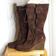 Stylish & Warm Ugg Size 11 Chocolate Brown Wedge Boots, The Elsey. New With Tags, Only Tried On In Store. The Tags Have Worn Off A Bit From Folks Trying Them On In The Store & Sitting In My Closet. They Have Never Been Worn Outside Of Nordstrom Rack. Size 11, 3.25 Inch Wedge With Approximately 0.5 Inch Height In Toes. Inside Front Of The Boot Is Lined With Shearling Down To Ankle. The Internal Back Is Lined With Leather. The Insole Is Lined With Soft & Warm Shearling. The Wedges Have A Slight Da Ugg Boots With Bows, 2000s Fall, Brown Uggs, Brown Wedge Boots, Ugg Ankle Boots, Lace Up Heel Boots, Pretty Halloween, Winter Leather Boots, Black High Heel Boots