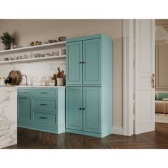 a kitchen with blue cabinets and marble counter tops