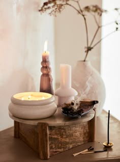 a table with candles and other items on it