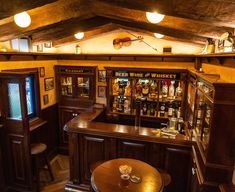 the inside of a bar with several bottles on it