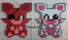 two cross stitched animals sitting next to each other