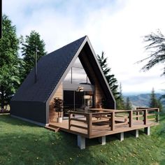 a small cabin with a porch and deck in the grass