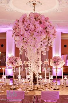 an image of a table setting with flowers and candles in the center, on instagram