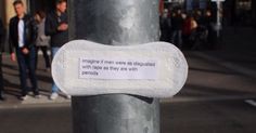 a sign on a pole that says imagine if men were disguised with tape as they are with periods