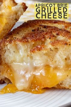 two grilled cheese sandwiches on a plate with the words apricot brie grilled cheese