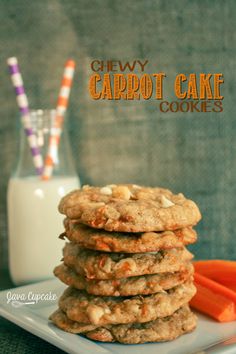 chewy carrot cake cookies stacked on top of each other with milk in the background