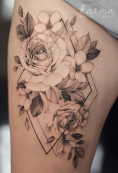 a woman's thigh with flowers and geometric shapes on the side, in black and white