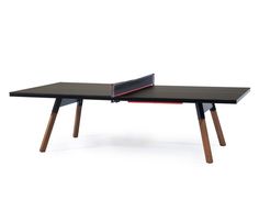 a ping pong table with two paddles on it