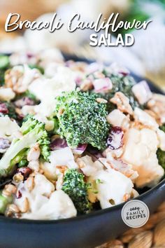 broccoli cauliflower salad in a black bowl with the title above it